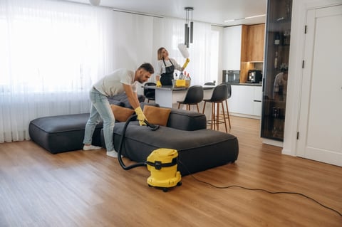 Modern interior of home with cleaning service workers